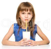 Cute little girl with a glass of milk