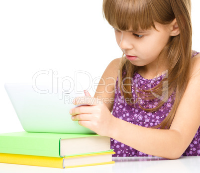 Young girl is using tablet