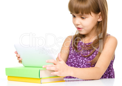 Young girl is using tablet