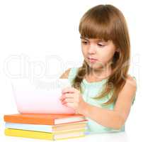 Young girl is using tablet