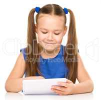 Young girl is using tablet