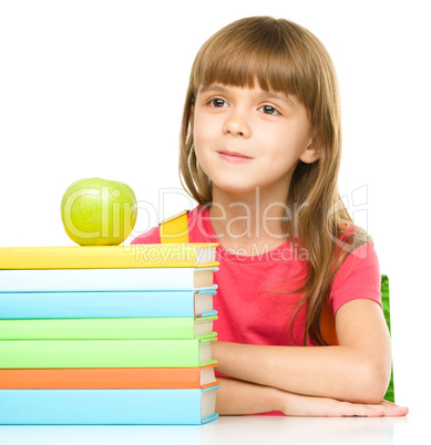 Little girl with her books