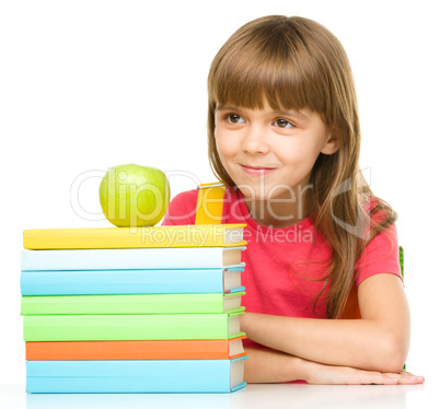 Little girl with her books