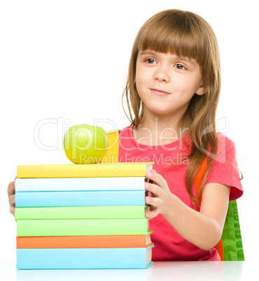 Little girl with her books