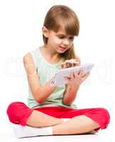 Young girl is using tablet