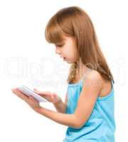 Young girl is using tablet