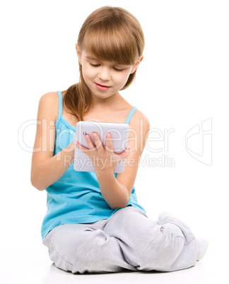 Young girl is using tablet