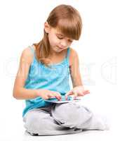 Young girl is using tablet