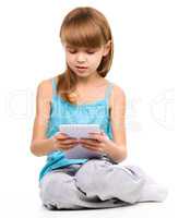 Young girl is using tablet