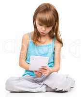 Young girl is using tablet