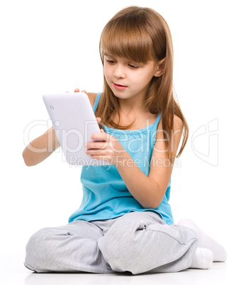 Young girl is using tablet