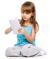 Young girl is using tablet