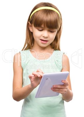 Young girl is using tablet