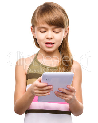 Young girl is using tablet