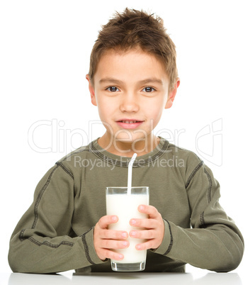 Cute boy with a glass of milk