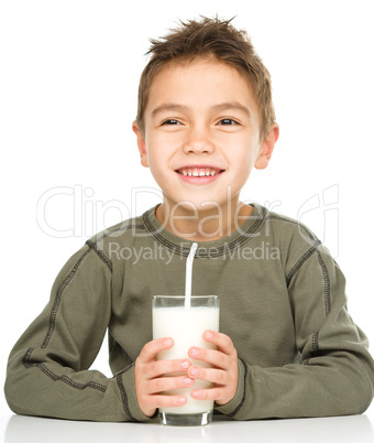 Cute boy with a glass of milk