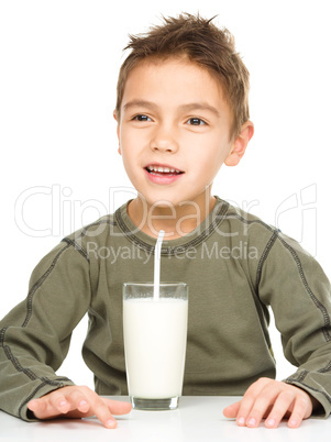 Cute boy with a glass of milk