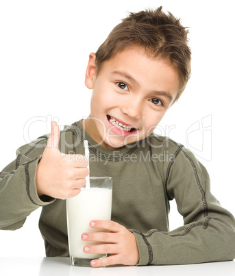 Cute boy with a glass of milk