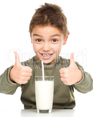 Cute boy with a glass of milk