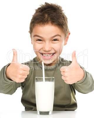 Cute boy with a glass of milk