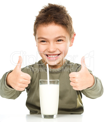 Cute boy with a glass of milk