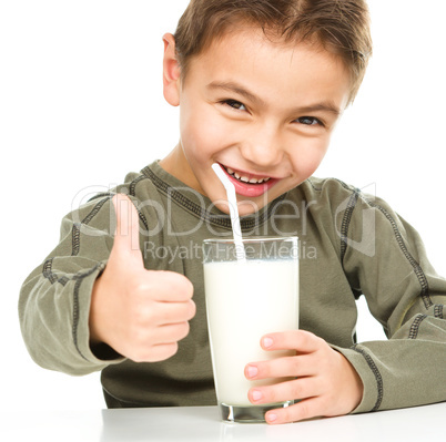 Cute boy with a glass of milk