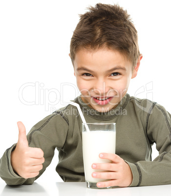 Cute boy with a glass of milk