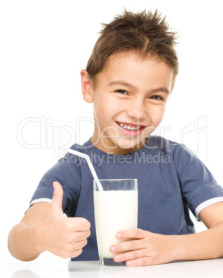 Cute boy with a glass of milk