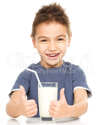 Cute boy with a glass of milk
