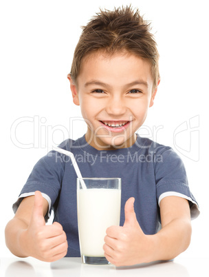 Cute boy with a glass of milk