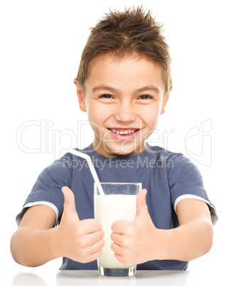 Cute boy with a glass of milk