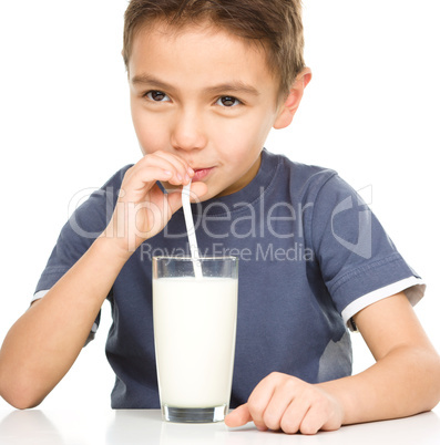 Cute boy with glass of milk