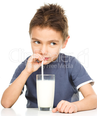 Cute boy with a glass of milk