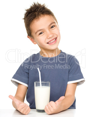 Cute boy with a glass of milk