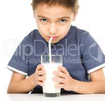 Cute boy with a glass of milk