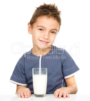 Cute boy with a glass of milk