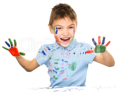 Portrait of a cute boy playing with paints Portrait of a cute boy playing with paints