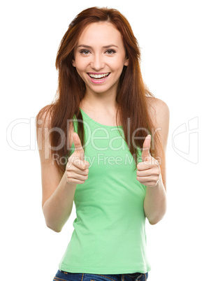 Woman is showing thumb up gesture