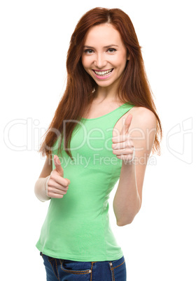 Woman is showing thumb up gesture