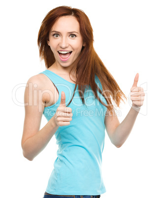 Woman is showing thumb up gesture