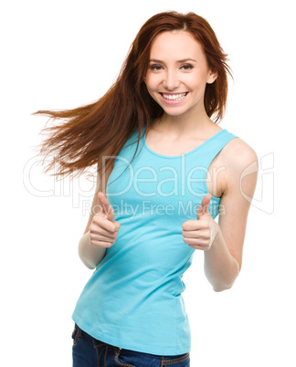 Woman is showing thumb up gesture