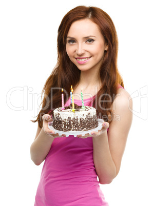 Young woman with anniversary cake