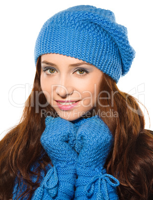 Young happy woman wearing winter cloth