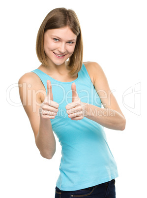 Woman is showing thumb up gesture