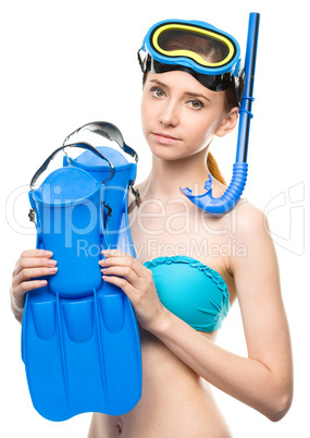 Young happy woman with snorkel equipment