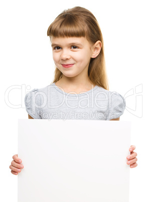 Little girl is holding blank banner