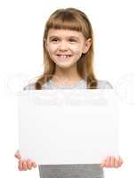 Little girl is holding blank banner