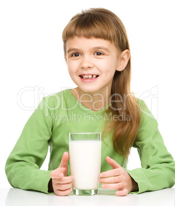 Cute little girl with a glass of milk