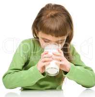 Cute little girl with a glass of milk