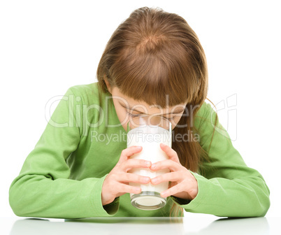 Cute little girl with a glass of milk